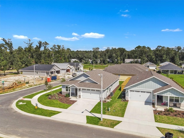 view of front of property with a garage and a front lawn