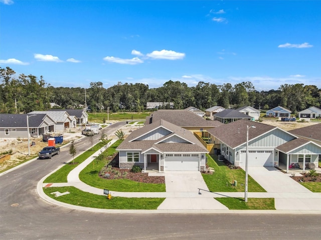 view of front of house with a garage and a front lawn