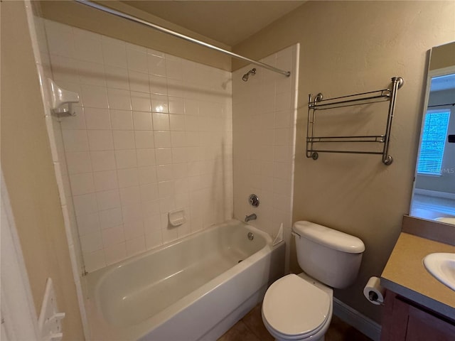 full bathroom with toilet, vanity, and tiled shower / bath combo