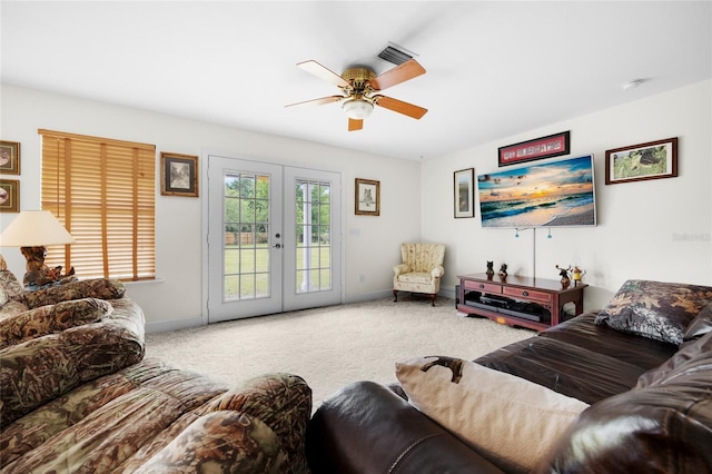 living room with carpet, ceiling fan, and french doors