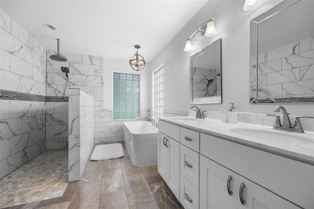 bathroom with vanity, a notable chandelier, and shower with separate bathtub