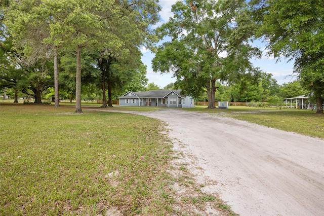 view of front of property featuring a garage and a front yard