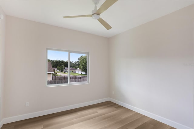 unfurnished room with ceiling fan and light wood-type flooring