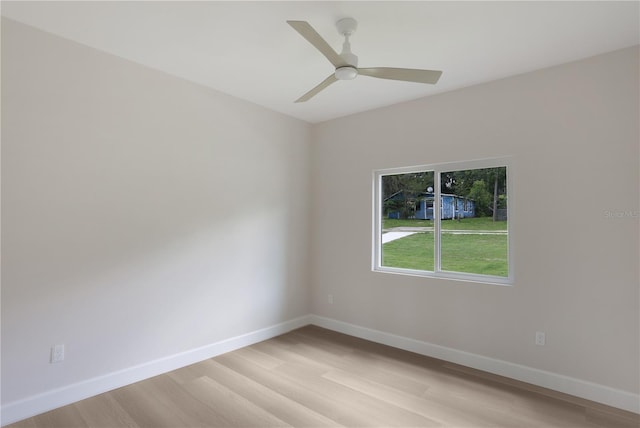 spare room with light hardwood / wood-style floors and ceiling fan