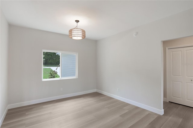 unfurnished room with light hardwood / wood-style floors