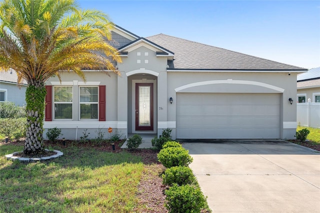 view of front facade with a front lawn and a garage