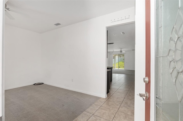 carpeted empty room with ceiling fan