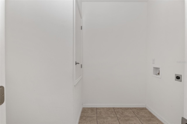 laundry room with hookup for a washing machine, light tile floors, and hookup for an electric dryer