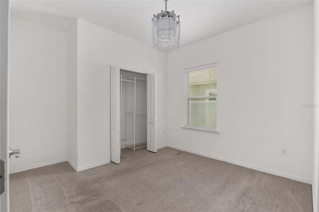 unfurnished bedroom with a closet and carpet flooring