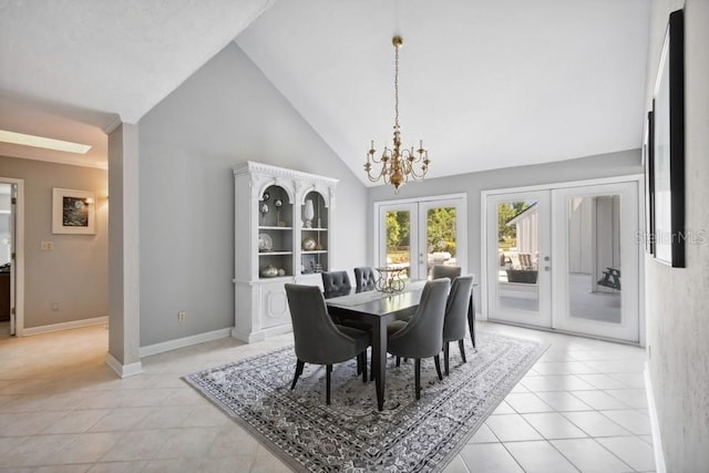 dining space with an inviting chandelier, light tile patterned floors, high vaulted ceiling, and french doors