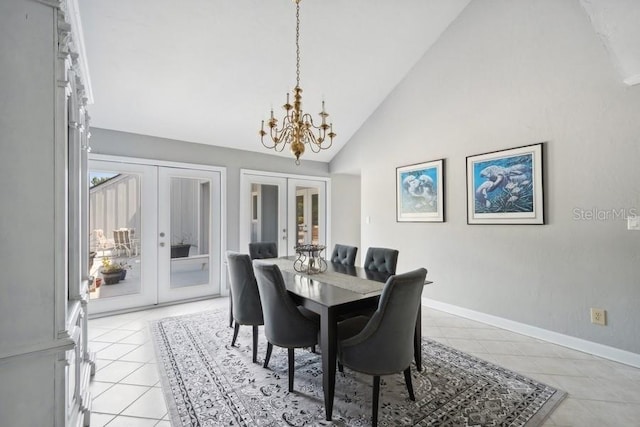 tiled dining space featuring french doors, high vaulted ceiling, and an inviting chandelier