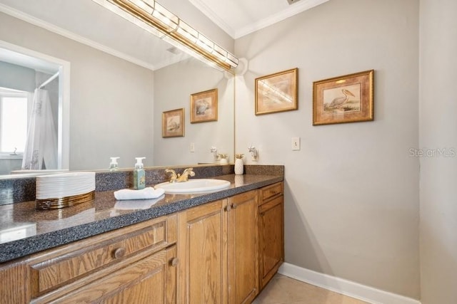 bathroom with tile patterned floors, crown molding, and vanity