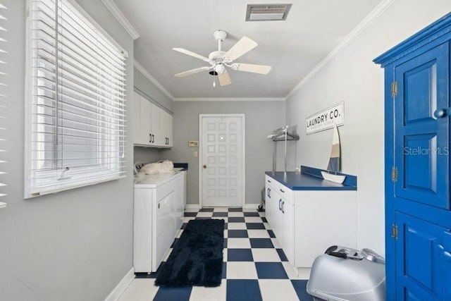 clothes washing area featuring washer and dryer, ceiling fan, cabinets, and crown molding