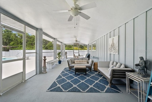 sunroom / solarium with ceiling fan, plenty of natural light, and vaulted ceiling