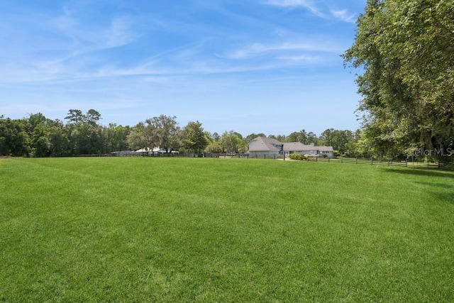 view of yard with a rural view