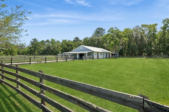 surrounding community featuring a rural view and an outdoor structure