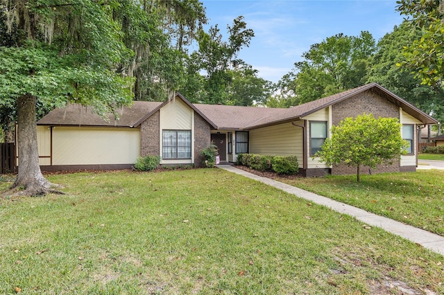 ranch-style house featuring a front lawn