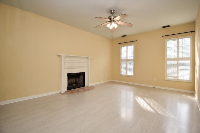 unfurnished living room with light hardwood / wood-style floors and ceiling fan