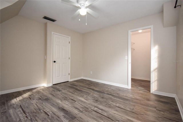 interior space featuring ceiling fan and dark wood-type flooring