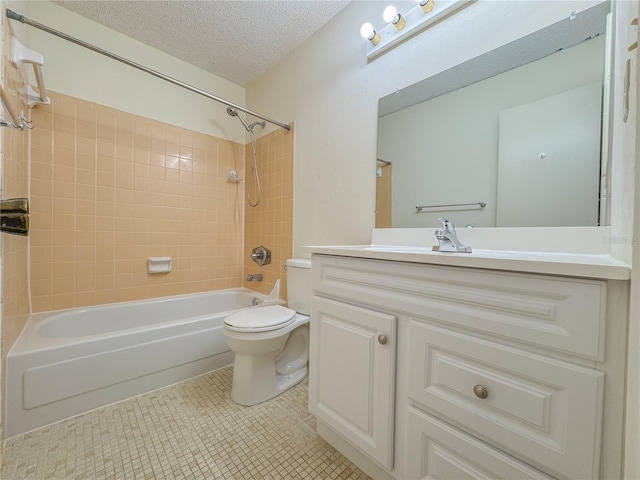 full bathroom featuring tile flooring, a textured ceiling, tiled shower / bath, vanity, and toilet