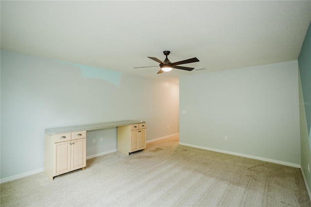 unfurnished room featuring ceiling fan and light colored carpet