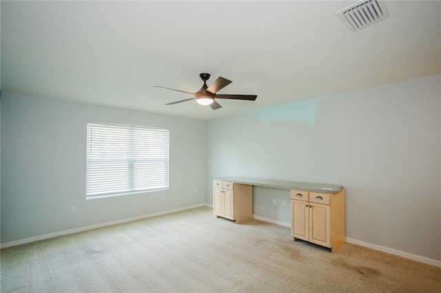 unfurnished room with light carpet and ceiling fan