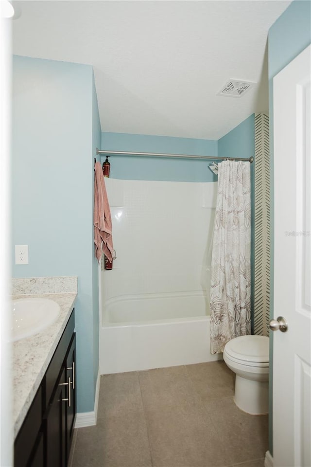 full bathroom featuring tile flooring, shower / bath combo, toilet, and vanity