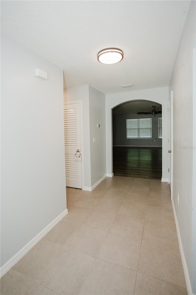 hallway with light tile floors