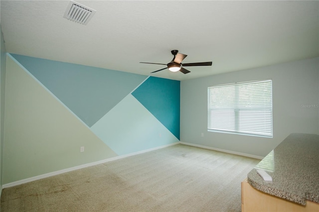 interior space featuring ceiling fan