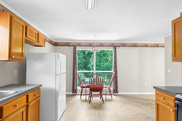 kitchen featuring crown molding, range with electric cooktop, white fridge, pendant lighting, and light tile floors