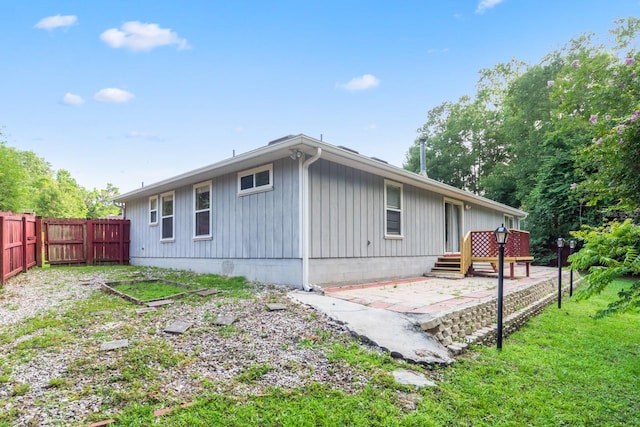 view of home's exterior featuring a patio and a yard