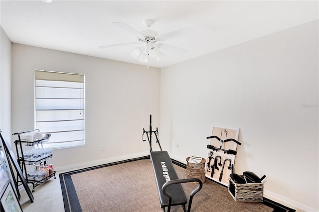 workout room with ceiling fan and carpet floors