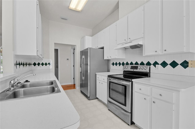 kitchen with white cabinetry, sink, appliances with stainless steel finishes, and tasteful backsplash