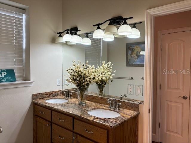 bathroom featuring dual bowl vanity