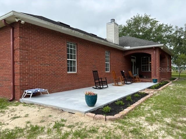 back of house with a patio area