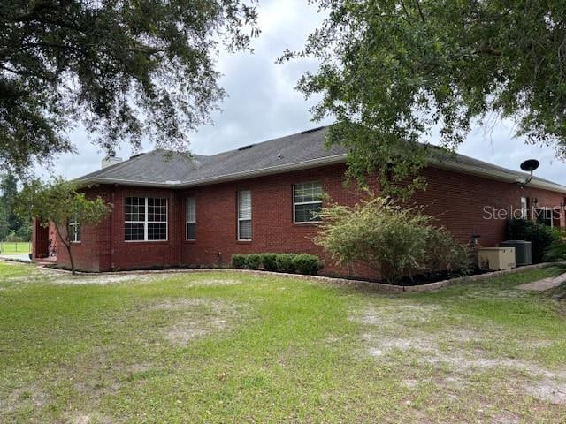 view of property exterior featuring a lawn