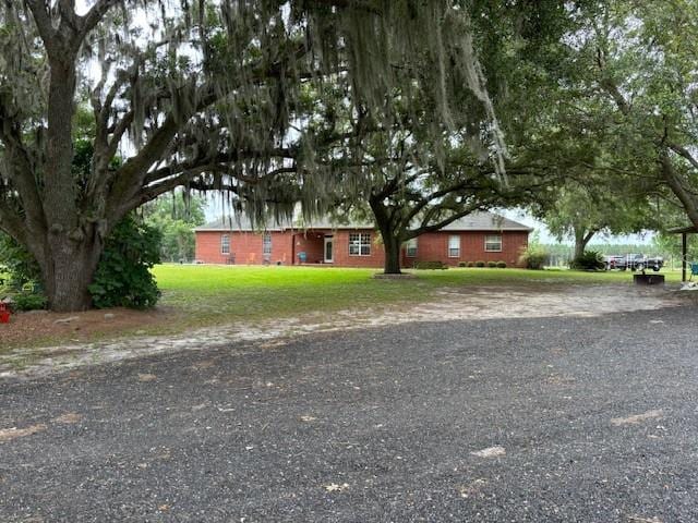 ranch-style house with a front lawn