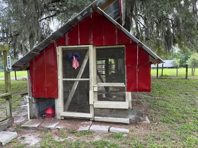 view of outdoor structure with a yard