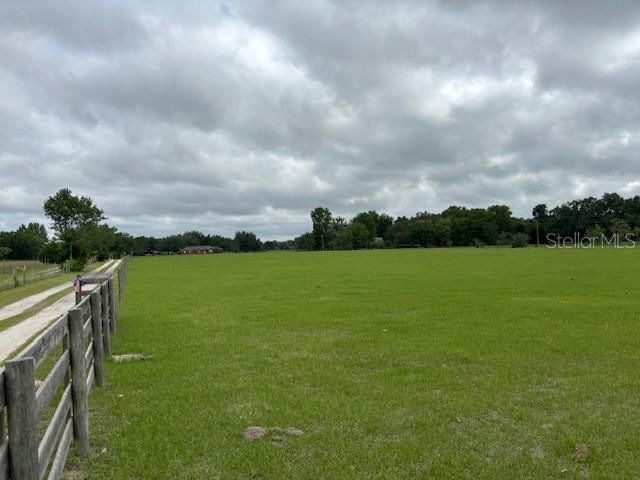 view of yard with a rural view