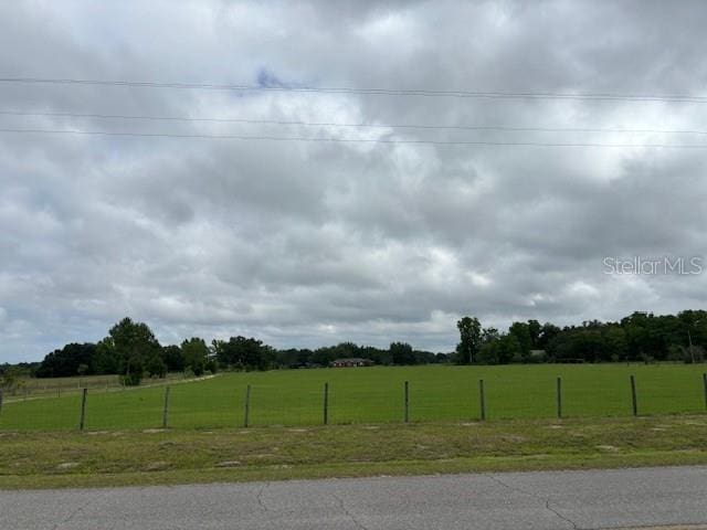 view of yard with a rural view