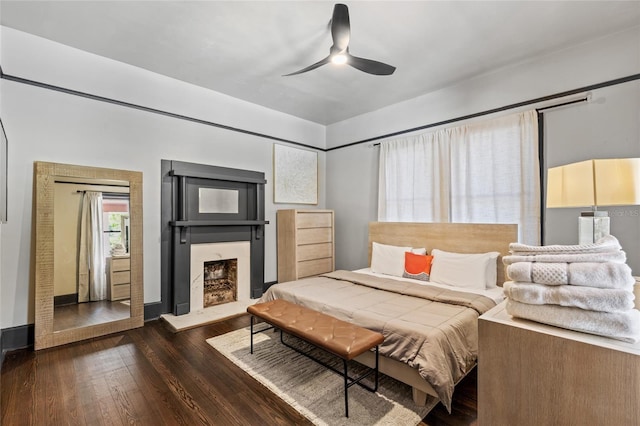 bedroom featuring ceiling fan and dark hardwood / wood-style floors