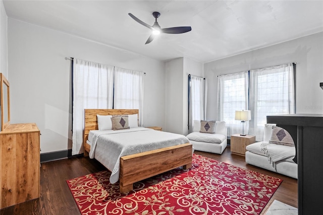 bedroom featuring ceiling fan and dark hardwood / wood-style floors