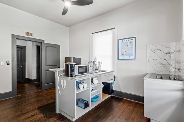 office area with dark hardwood / wood-style flooring and ceiling fan