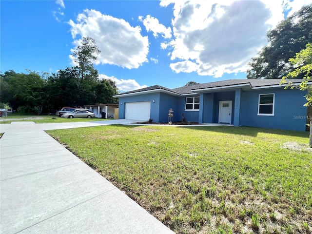 single story home featuring a garage and a front lawn