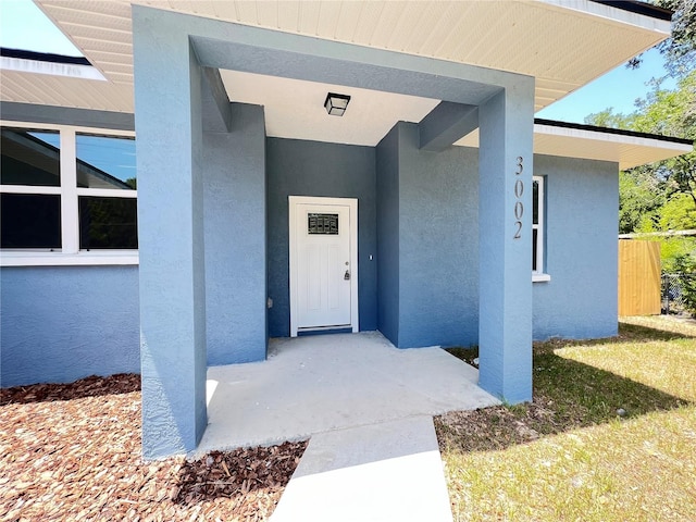 entrance to property with a yard