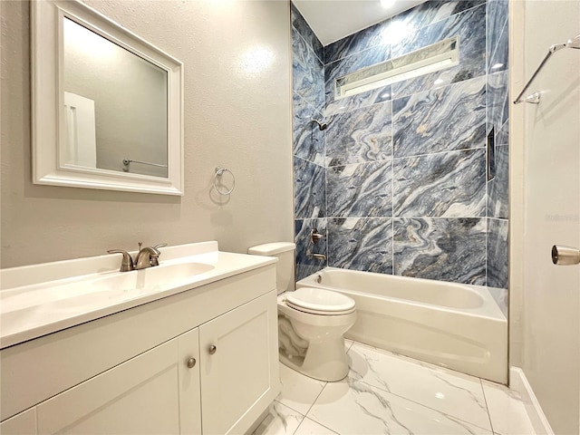 full bathroom featuring tile floors, toilet, tiled shower / bath, and vanity with extensive cabinet space