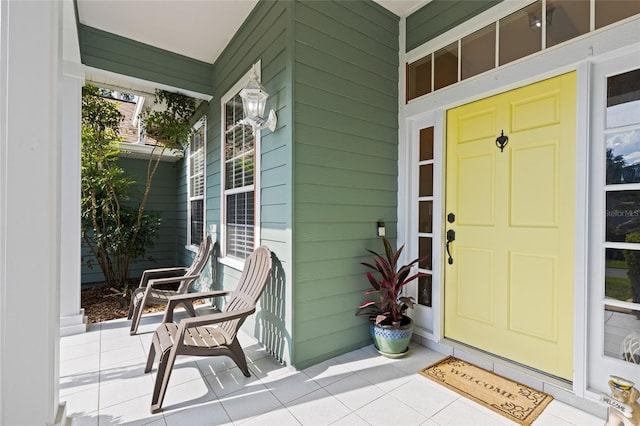 doorway to property featuring covered porch