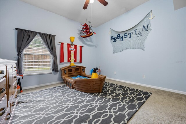 living area with ceiling fan and carpet floors