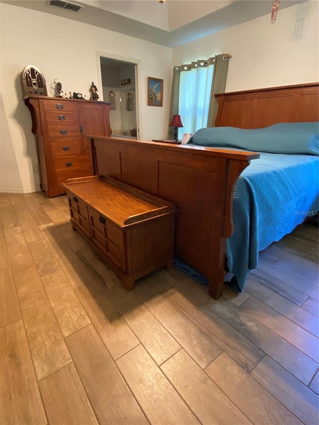 bedroom with light wood-type flooring