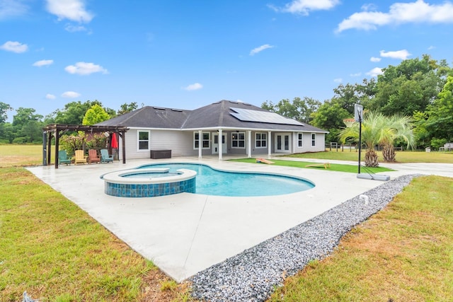 view of swimming pool featuring a pergola, a patio area, an in ground hot tub, and a yard